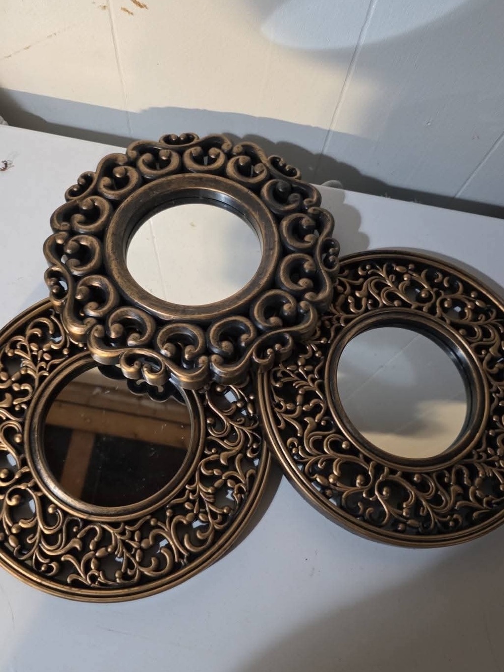 Ornate Round Wall Mirror Set in Antique Bronze